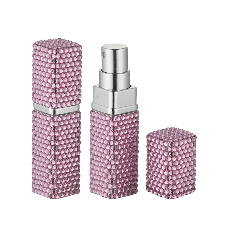 Purple diamond-shaped haute couture perfume bottle